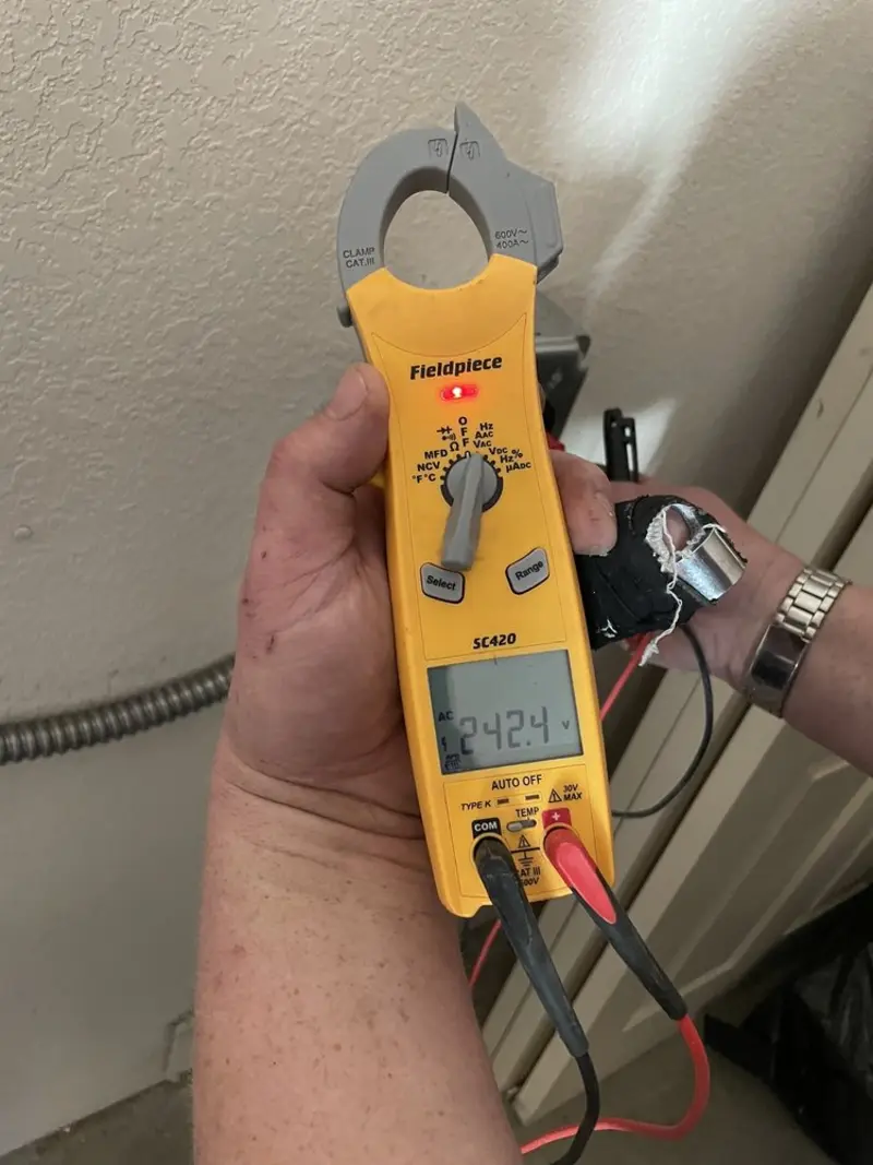 Voltage testing with clamp meter during Ceiling Fan Installation in Lyman